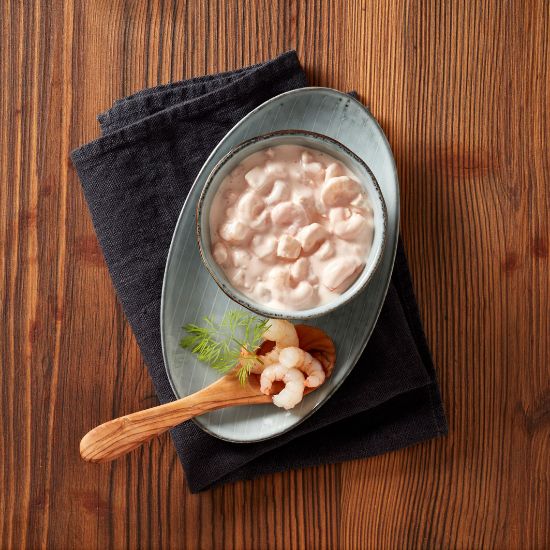Bild von Holsteiner Shrimpscocktail mit der Beschreibung mild-würziger Salat aus Garnelen und aromatischen Apfelwürfeln