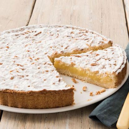 Bild von Torta della Nonna  Ø27cm mit der Beschreibung Zitronenmandelkuchen. vorgeschnitten in 14 Stk