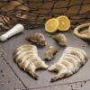 Bild von Black Tiger Garnelen "Easy Peel" 8/12 mit der Beschreibung ohne Kopf,mit angeschlizter Schale - leicht zu "pulen".Ideal zum Grillen,für Salate & Nudelgerichte