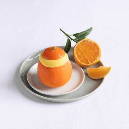 Bild von Mandarino Ripieno mit der Beschreibung Mandarinensorbet in echter Fruchtschale, servierfertig